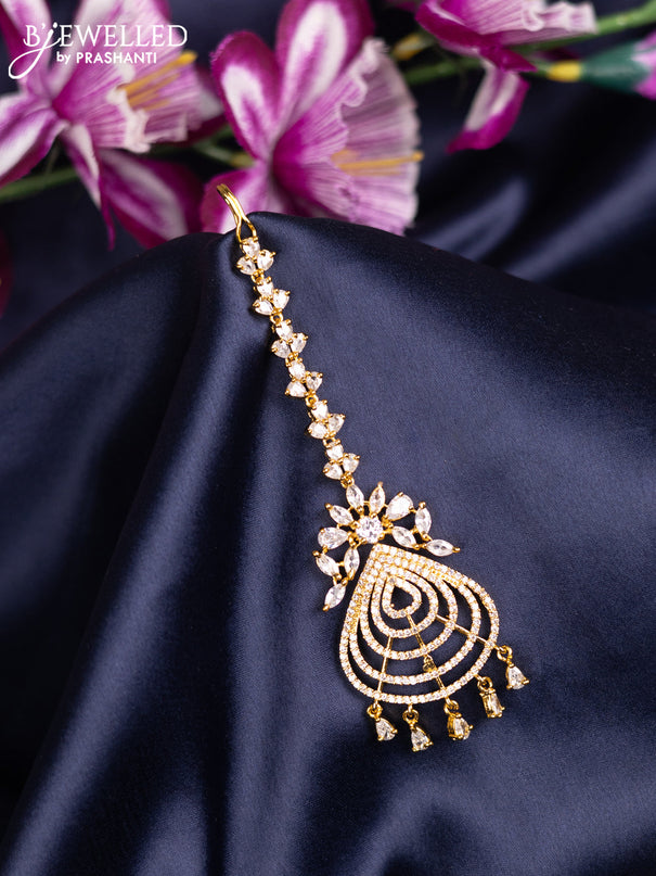 Zircon maang tikka with cz stones and hanings in gold finish