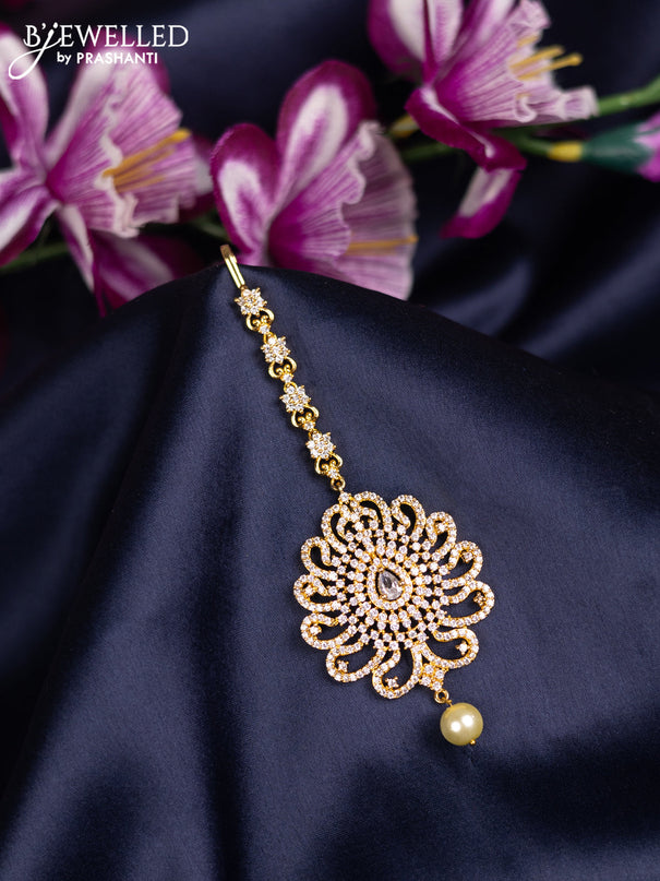 Zircon maang tikka with cz stones and pearl hanings in gold finish