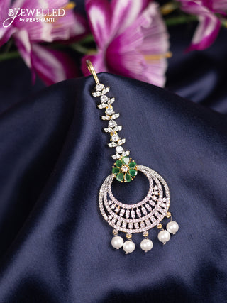 Zircon maang tikka with emerald & cz stones and pearl hanings in gold finish