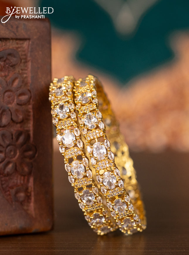Zircon bangles with cz stones in gold finish