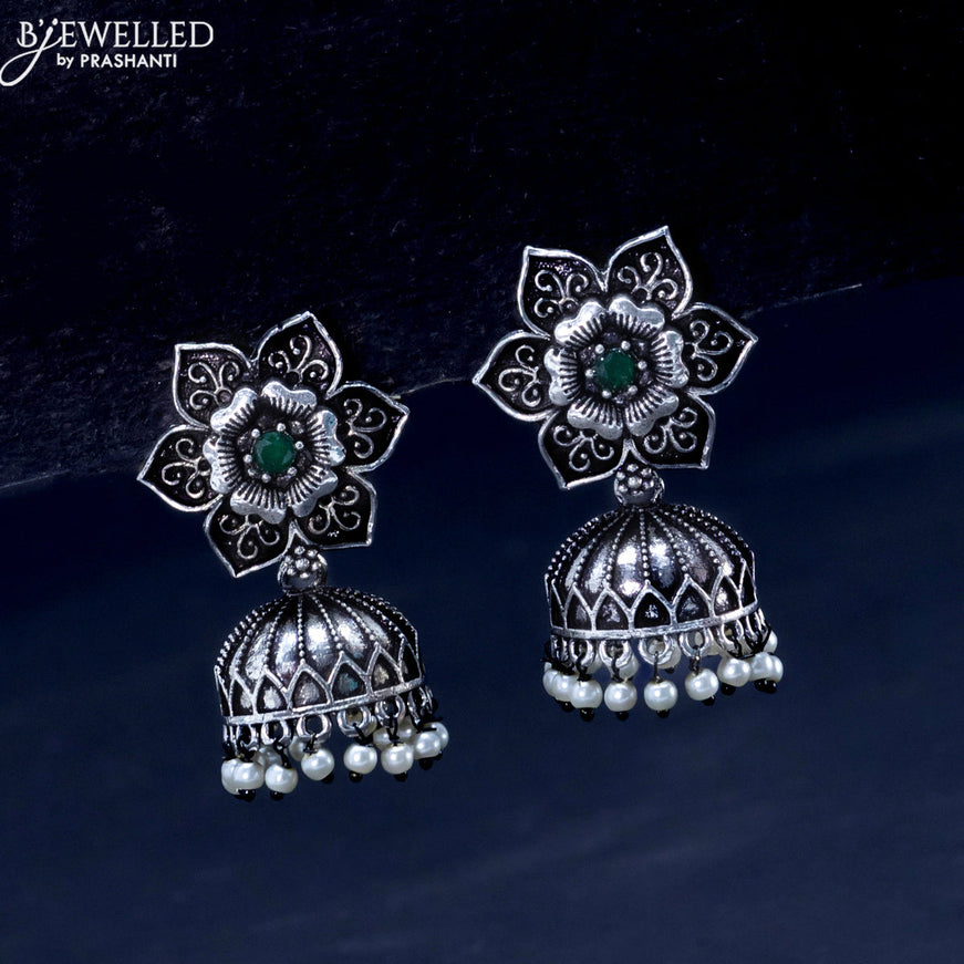 Oxidised jhumka floral design with emerald stones and pearl hangings