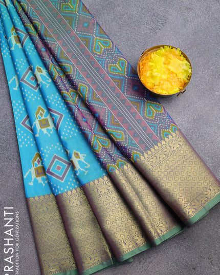 Semi tussar saree dual shade of teal blue and dual shade of green with allover patola prints and long zari woven border