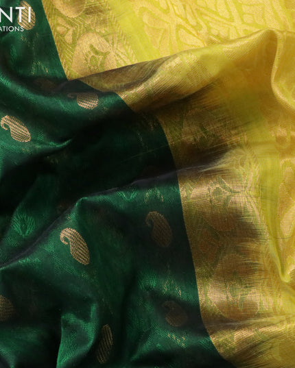 Kuppadam silk cotton saree dark green and yellow with allover self emboss & zari buttas and zari woven border