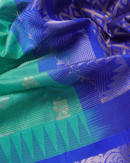 Kuppadam silk cotton saree teal blue and blue with allover vairosi pattern & zari buttas and temple design long silver zari woven border
