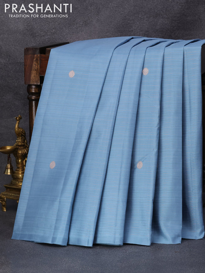 Pure kanjivaram silk saree pastel blue shade with allover zari stripes pattern & zari buttas in borderless style