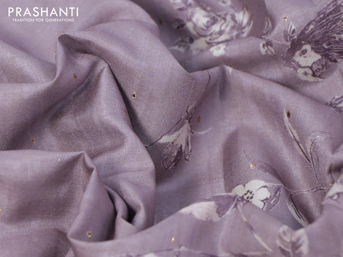 Tussar silk saree mild purple shade and cream with allover zari buttas and floral design cross stitched embroidery border