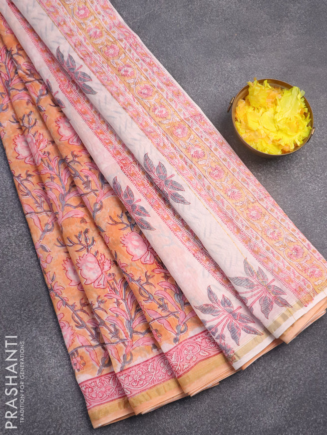 Chanderi bagru saree peach orange with allover floral prints and zari woven border