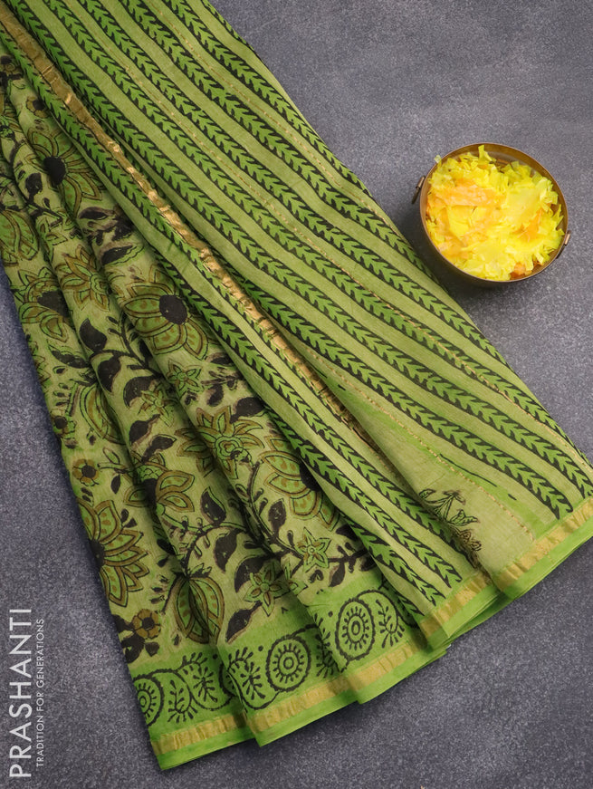Chanderi bagru saree light green with allover prints and zari woven border
