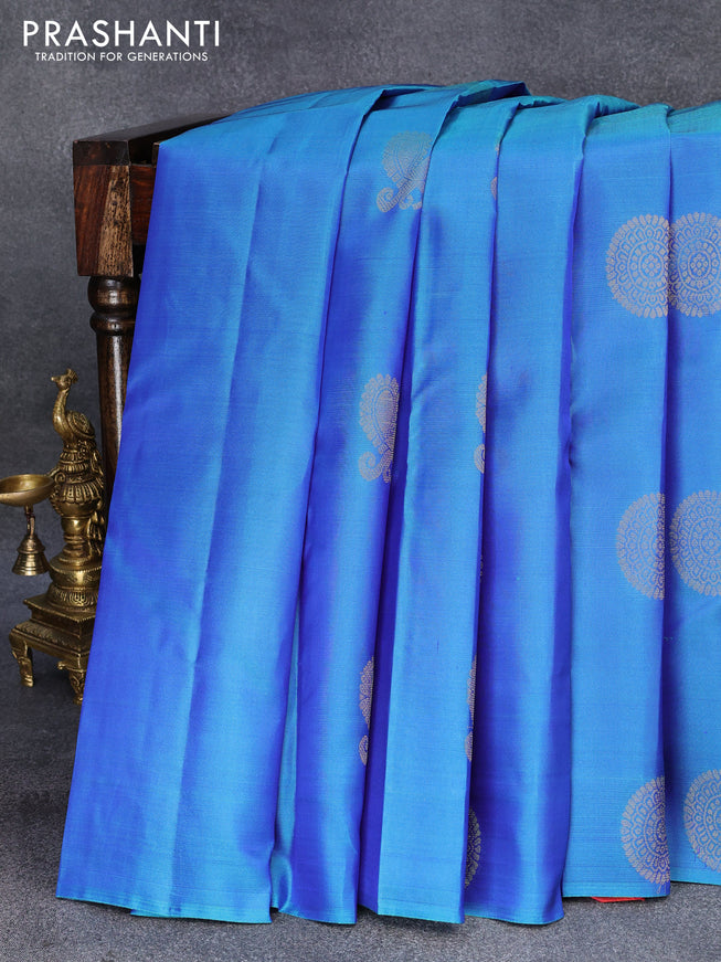 Pure kanjivaram silk saree dual shade of blue and dual shade of pinkish orange with zari woven buttas in borderless style