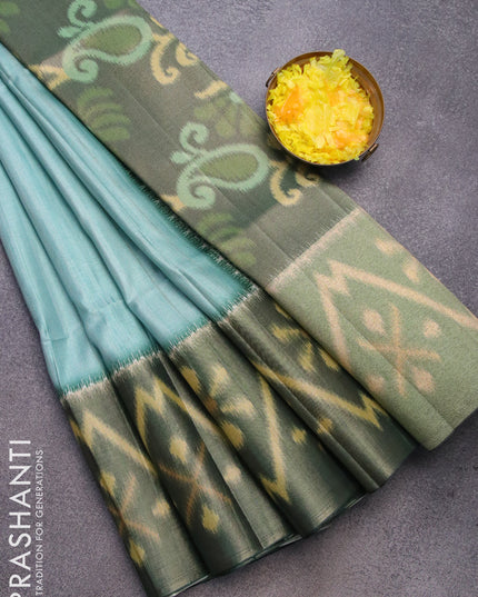 Semi matka saree pastel blue and dark green with plain body and ikat style border