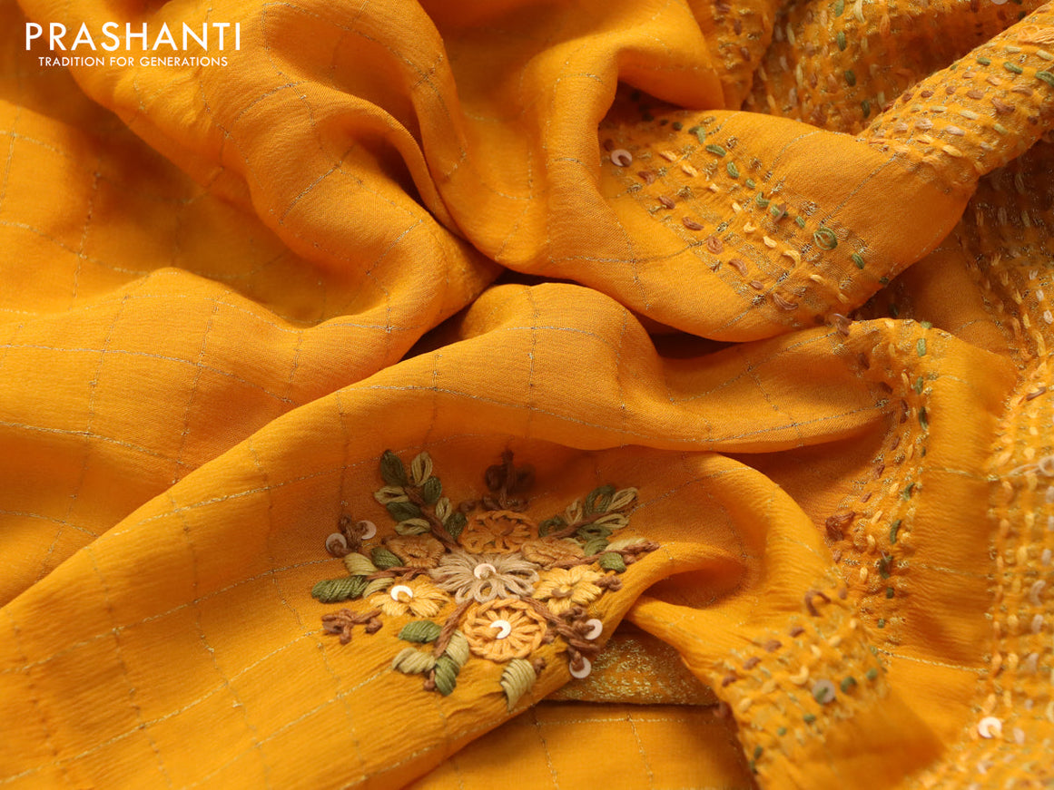 Semi crepe saree mango yellow with allover zari checked pattern & embroidery work buttas and small zari woven border