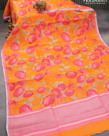 Pure linen saree orange and pink shade with allover floral prints and silver zari woven piping border
