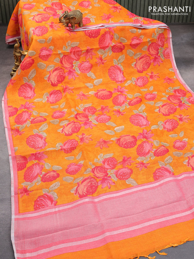Pure linen saree orange and pink shade with allover floral prints and silver zari woven piping border