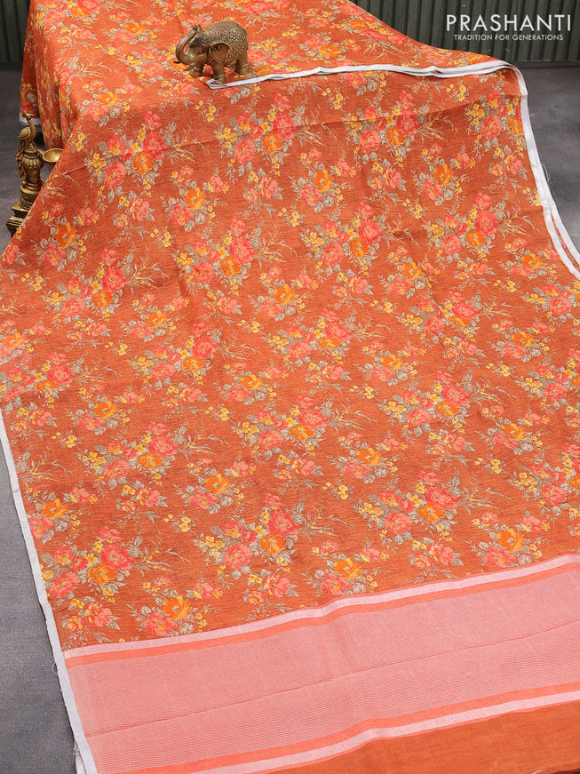 Pure linen saree rustic orange with allover floral prints and silver zari woven piping border