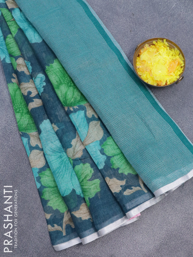 Pure linen saree peacock blue with floral prints and silver zari woven piping border