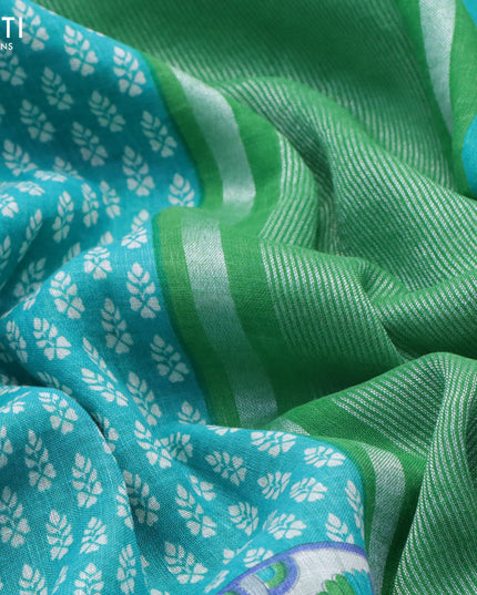 Pure linen saree teal blue and light green with allover butta prints and silver zari woven piping border