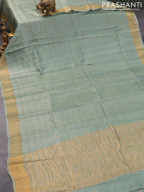 Pure tussar silk saree pastel green and peach orange with allover zari checked pattern and zari woven border and Kalamkari printed blouse