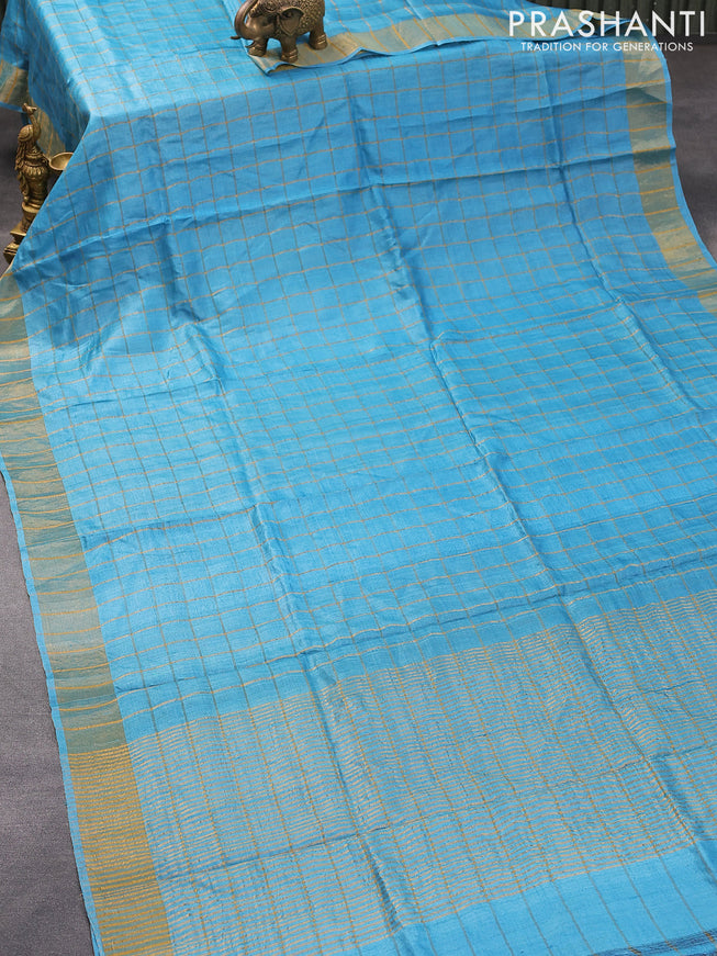 Pure tussar silk saree light blue and rustic orange with allover zari checked pattern and zari woven border and Kalamkari printed blouse