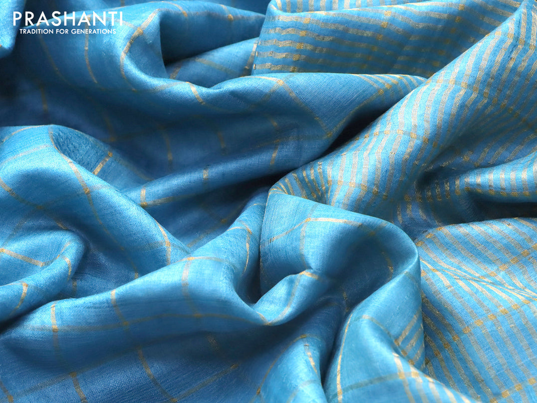 Pure tussar silk saree light blue and rustic orange with allover zari checked pattern and zari woven border and Kalamkari printed blouse