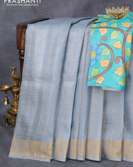 Pure tussar silk saree pastel grey and teal blue with allover zari checked pattern and zari woven border and Kalamkari printed blouse