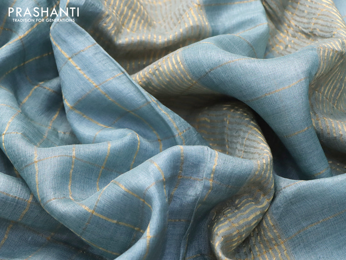 Pure tussar silk saree pastel blue and elephant grey with allover zari checked pattern and zari woven border and Kalamkari printed blouse
