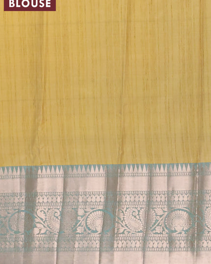 Banarasi semi tussar saree yellow shade and teal blue with allover ikat weaves and long zari woven border