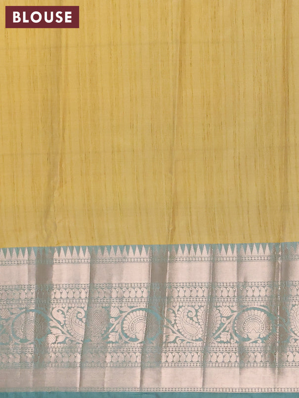Banarasi semi tussar saree yellow shade and teal blue with allover ikat weaves and long zari woven border