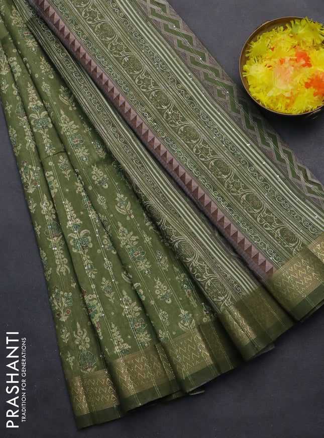 Semi tussar saree mehendi green with allover prints & sequin work and zari woven border