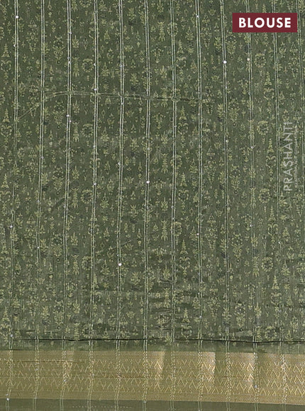 Semi tussar saree mehendi green with allover prints & sequin work and zari woven border