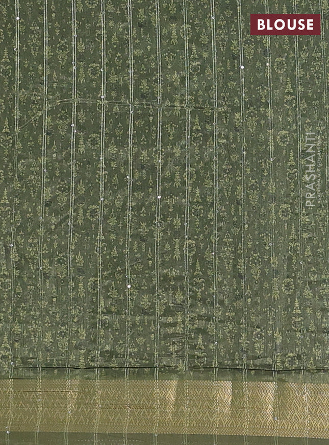 Semi tussar saree mehendi green with allover prints & sequin work and zari woven border