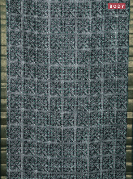 Semi tussar saree green with allover leaf prints & sequin work and zari woven border