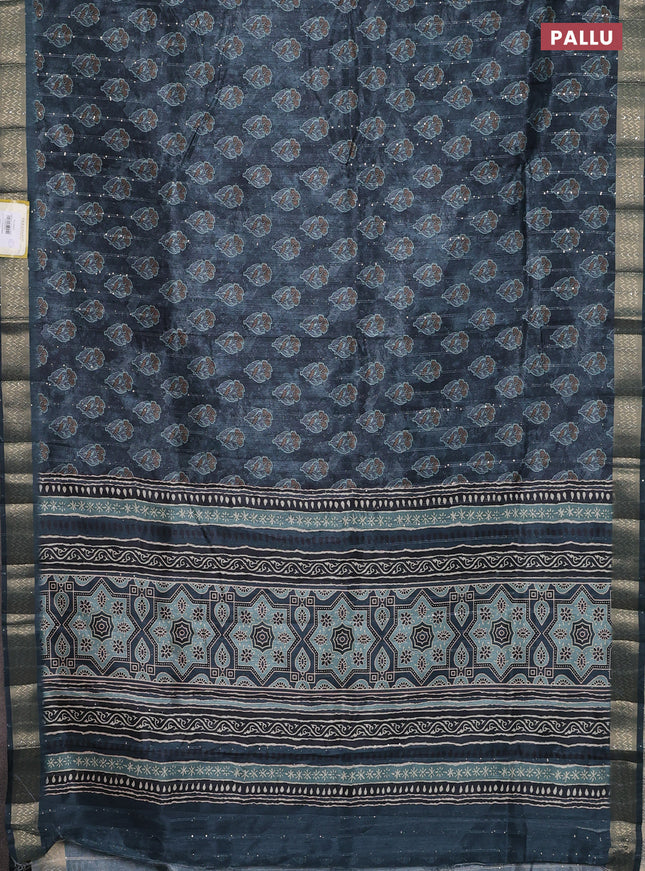 Semi tussar saree dark peacock green with floral butta prints & sequin work and zari woven border
