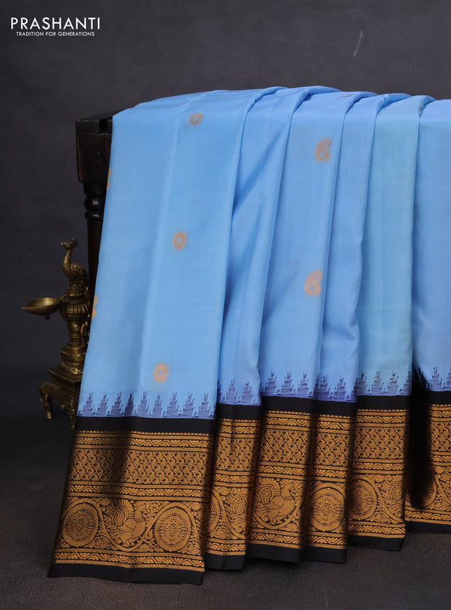 Pure gadwal silk saree light blue and black with paisley zari woven buttas and temple design zari woven border