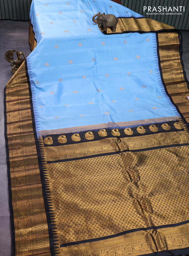 Pure gadwal silk saree light blue and black with paisley zari woven buttas and temple design zari woven border