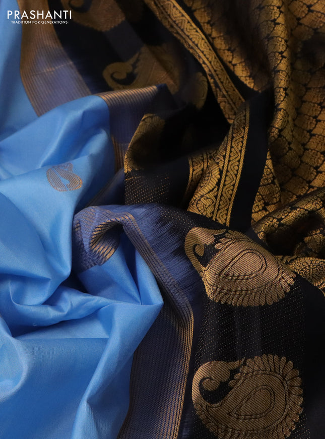 Pure gadwal silk saree light blue and black with paisley zari woven buttas and temple design zari woven border