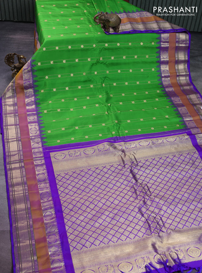 Pure gadwal silk saree green and violet with allover zari weaves & Buttas and temple design rettapet zari woven border