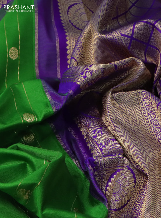 Pure gadwal silk saree green and violet with allover zari weaves & Buttas and temple design rettapet zari woven border