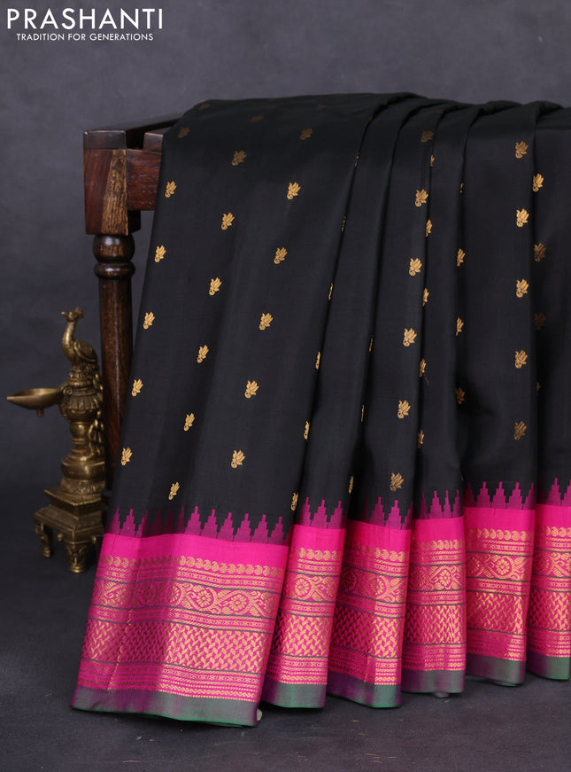 Pure gadwal silk saree black and magenta pink with allover zari woven buttas and temple design zari woven border