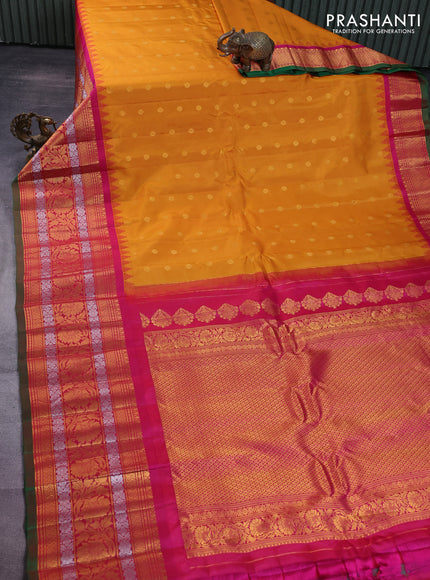 Pure gadwal silk saree mustard yellow and pink with zari woven buttas and temple design long zari woven border