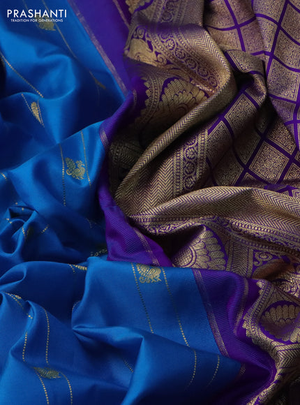 Pure gadwal silk saree cs blue and violet with allover zari weaves & buttas and long temple design rettapet zari woven border