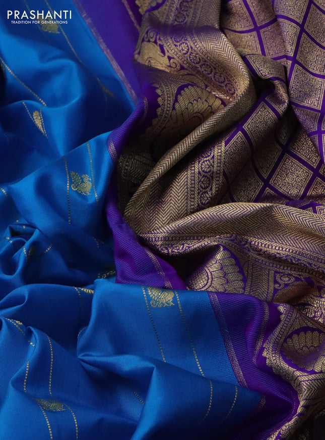 Pure gadwal silk saree cs blue and violet with allover zari weaves & buttas and long temple design rettapet zari woven border