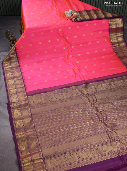 Pure gadwal silk saree dual shade of pinkish orange and deep purple with annam zari woven buttas and temple design zari woven annam border