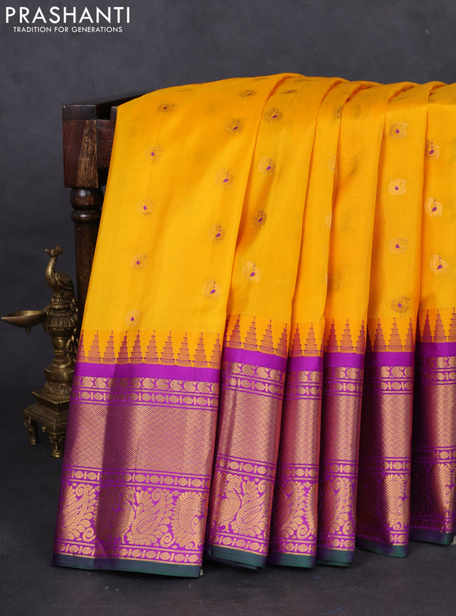 Pure gadwal silk saree yellow and purple with annam zari woven buttas and long temple design zari woven border