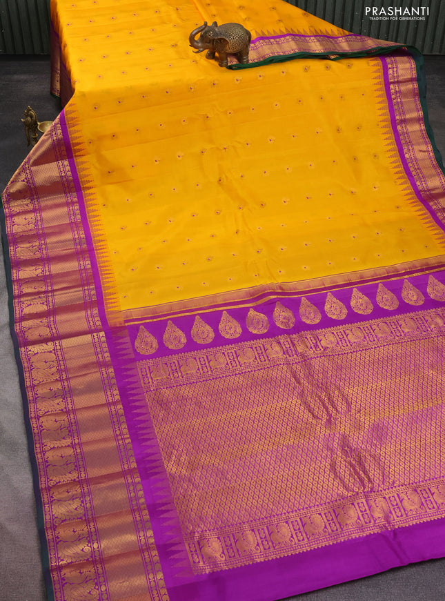 Pure gadwal silk saree yellow and purple with annam zari woven buttas and long temple design zari woven border