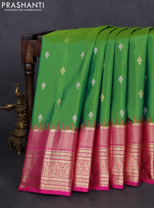 Pure gadwal silk saree parrot green and pink with silver zari woven Buttas and long zari woven korvai border