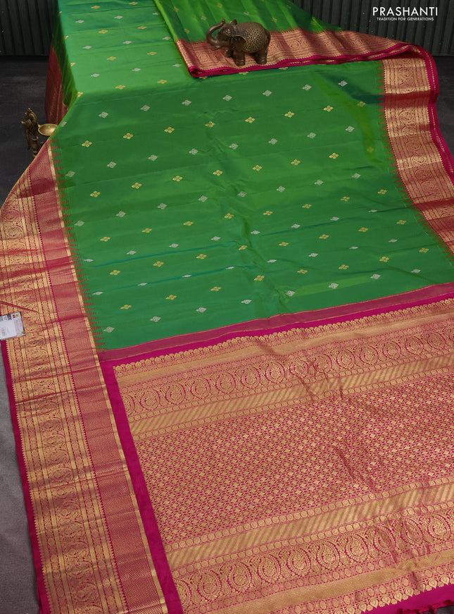 Pure gadwal silk saree parrot green and pink with silver zari woven Buttas and long zari woven korvai border