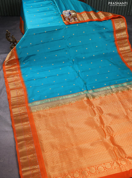Pure gadwal silk saree teal blue and orange with zari woven buttas and temple design zari woven border
