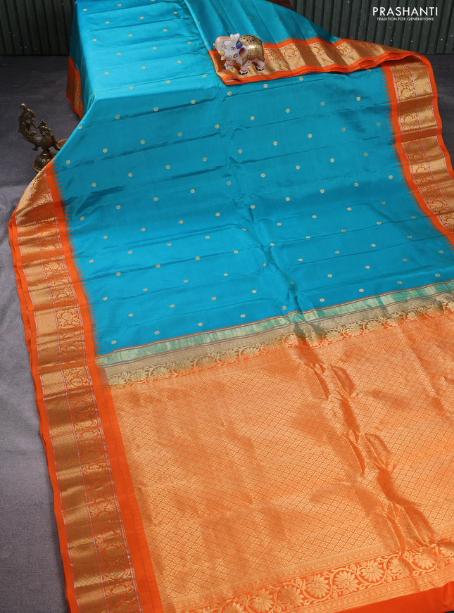 Pure gadwal silk saree teal blue and orange with zari woven buttas and temple design zari woven border