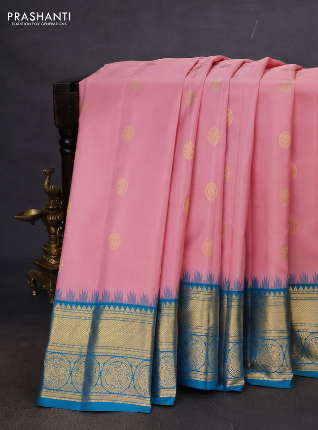 Pure gadwal silk saree peach pink shade and teal blue with zari woven buttas and rich zari woven korvai border