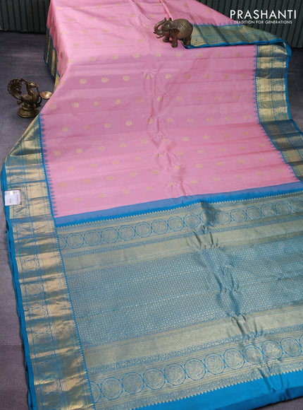 Pure gadwal silk saree peach pink shade and teal blue with zari woven buttas and rich zari woven korvai border